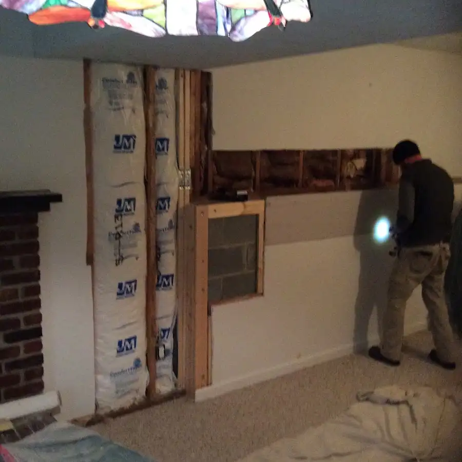 Restoration technician inspecting water damage in McGregor